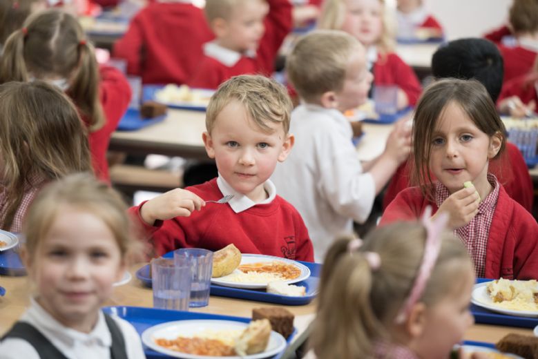 Children eating in the dinner hall.