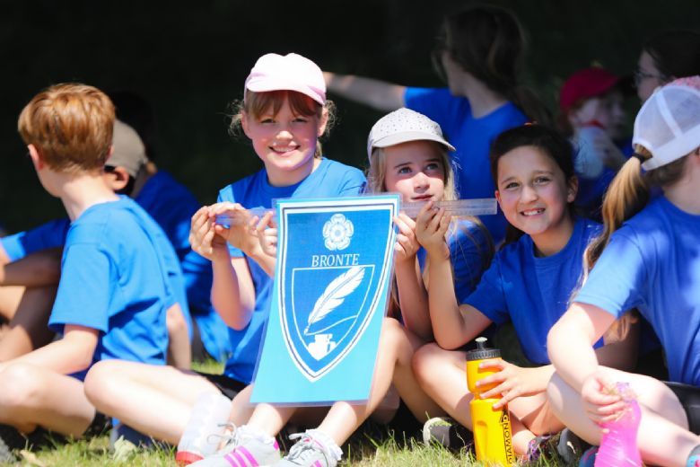 Bronte children on Sports Day, sitting in the shade.
