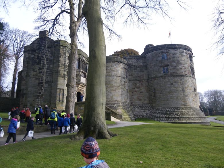 Children walking up to Skipton Castle.