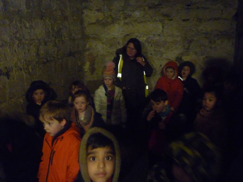 Children in the dungeon at Skipton Castle.